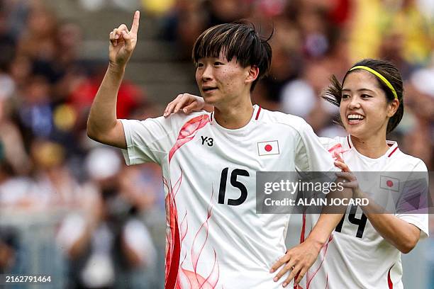 Japan's midfielder Aoba Fujino celebrates after scoring her team's first goal in the women's group C football match between Spain and Japan during...