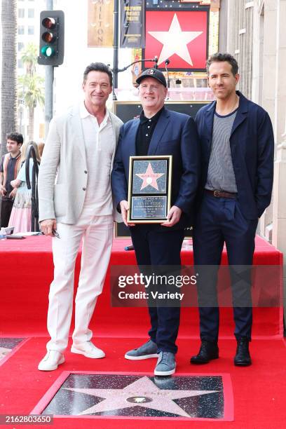 Hugh Jackman, Kevin Feige and Ryan Reynolds at the ceremony honoring Kevin Feige with a star on the Hollywood Walk of Fame held in front of the El...