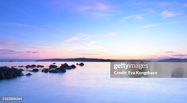 the afterglow is amazing if you just have the patient to wait for it - northern europe stock pictures, royalty-free photos & images