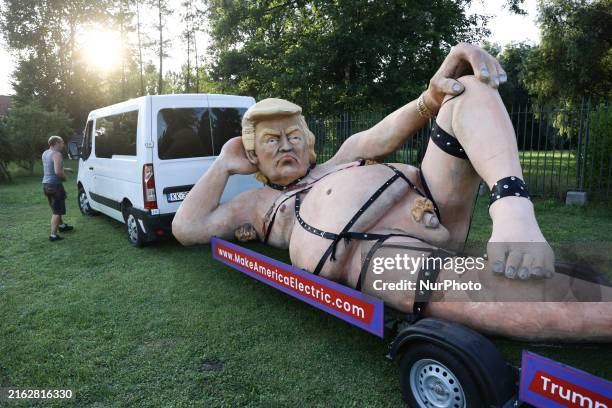 Donald Trump caricature is seen on a trailer in Krakow, Poland on July 25, 2024. The figure, which was previously a theater prop, has been bought by...