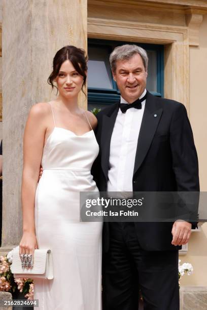 Gloria Soeder and her father Bavarian Prime Minister Markus Soeder attend the premiere of Tristan and Isolde" to open the annual Bayreuth Festival...