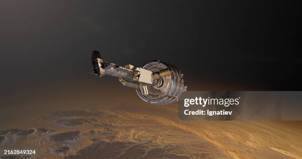 the space station is contrasted by the red planet in the background - lunar excursion module stock pictures, royalty-free photos & images