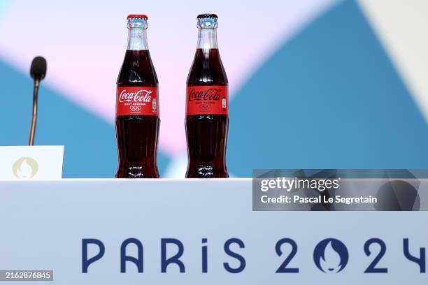 Bottles of Coca-Cola are seen during the Paris 2024 President and CEO press conference at the Main Press Centre on July 21, 2024 in Paris, France.