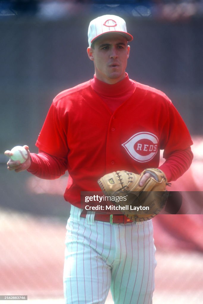 Baseball Teletype Reds Dan Wilson of the Cincinnati Reds warms up before a baseball game ...