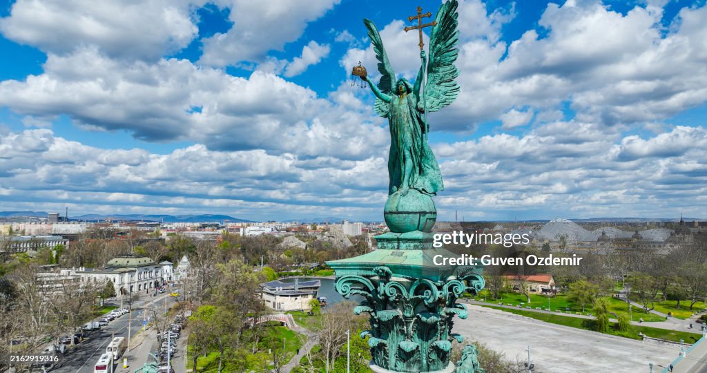 Aerial view of Statues on Historic Columns Against Cloudy Sky in Heroes' Square in Budapest, Hungary, Aerial view of Heroes' Square and Andrassy Street, Top-down aerial view of Heroes' Square in Budapest
