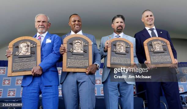 Inductees, from left, Jim Leyland, Adrian Beltre, Todd Helton and Joe Mauer pose for a photograph with their plaques during the Baseball Hall of Fame...