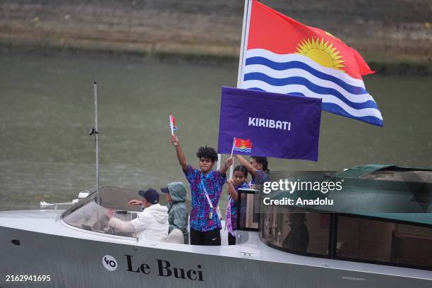 Athletes of Team Kiribati are seen on a boat along the River Seine during the opening ceremony of the Olympic Games Paris 2024 on July 26, 2024 in...