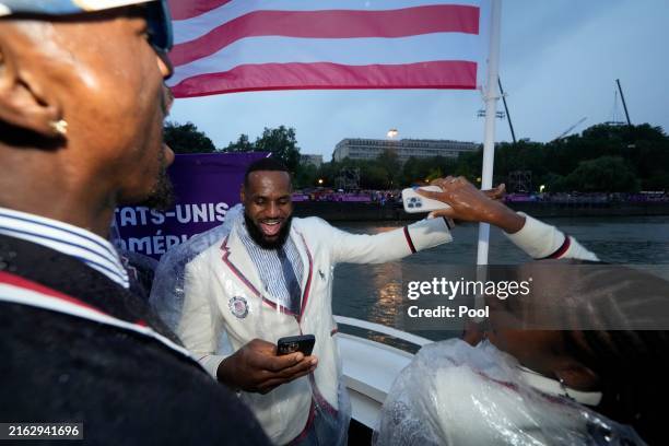 United States' Coco Gauff and Lebron James in Paris, France, travel along the Seine River during the opening ceremony of the 2024 Summer Olympics,...
