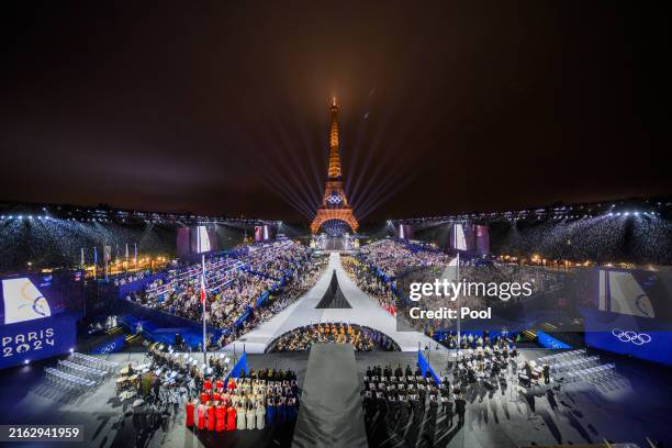 The Olympic flag is rasied at the Place du Trocadero in front of the Eiffel Tower during the Opening Ceremony of the Olympic Games Paris 2024 on July...