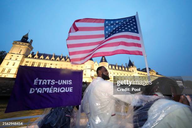 Athletes Coco Gauff and Lebron James of team United States are seen on a boat on the River Seine during the opening ceremony of the Olympic Games...