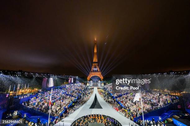 The Olympic flag is rasied at the Place du Trocadero in front of the Eiffel Tower during the Opening Ceremony of the Olympic Games Paris 2024 on July...