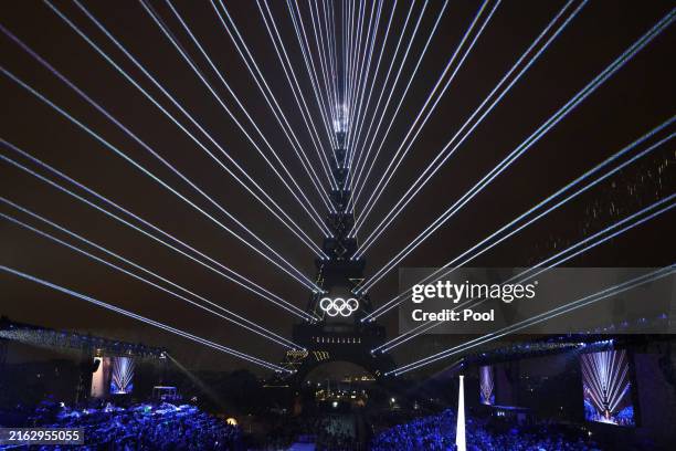 Lights illuminate the Eiffel Tower during the Opening Ceremony of the Olympic Games Paris 2024 on July 26, 2024 in Paris, France.