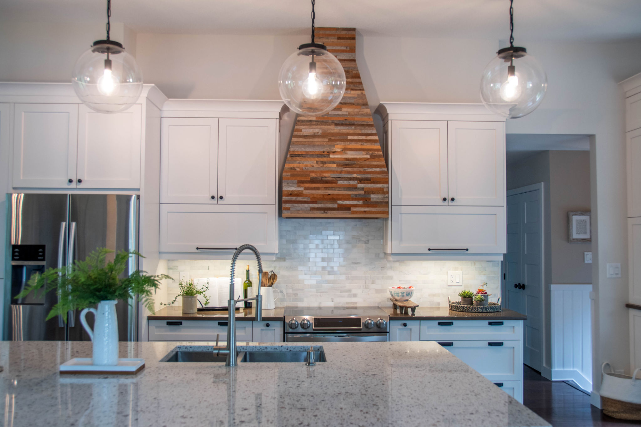 Modern country kitchen with reclaimed wood hood fan Modern country kitchen with reclaimed wood hood fan