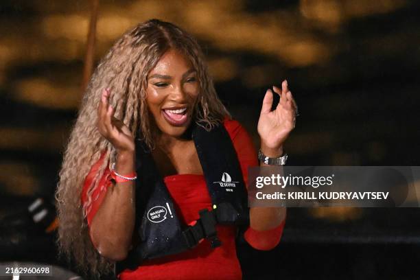 Tennis player Serena Williams reacts prior to hand over the Olympics torch during the opening ceremony of the Paris 2024 Olympic Games in Paris on...