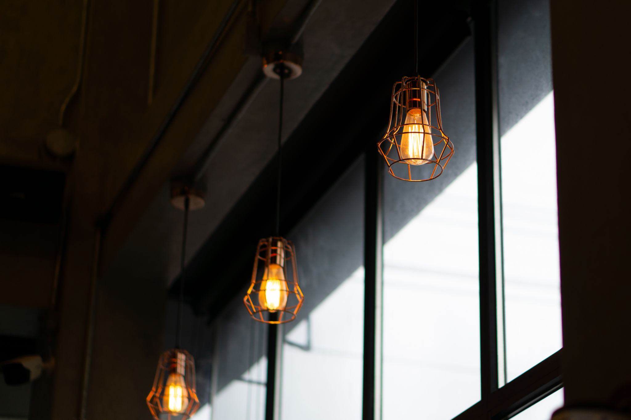 Moody Industrial Lighting Fixtures in a Rustic-Modern Interior Space Moody Industrial Lighting Fixtures in a Rustic-Modern Interior Space