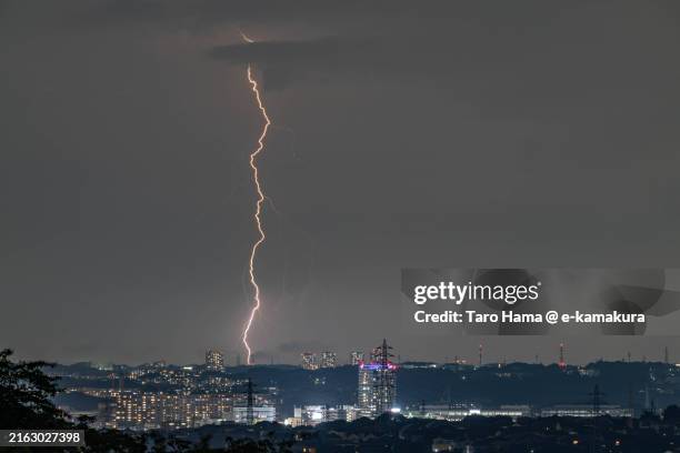 lightning over the residential district in kanagawa of japan - lightning home stock pictures, royalty-free photos & images