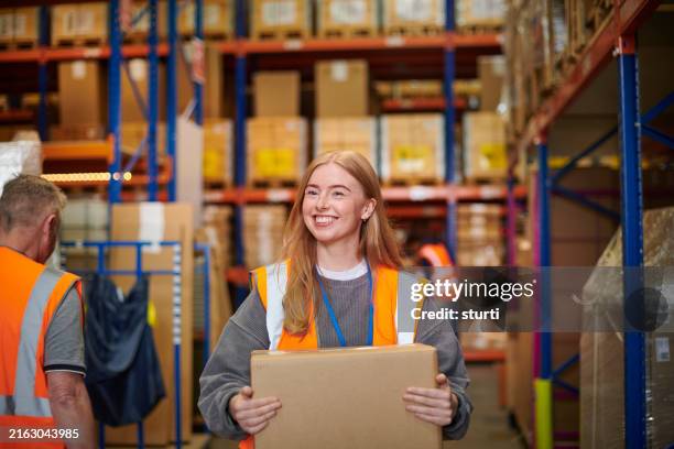 happy young warehouse worker - warehouse stock pictures, royalty-free photos & images
