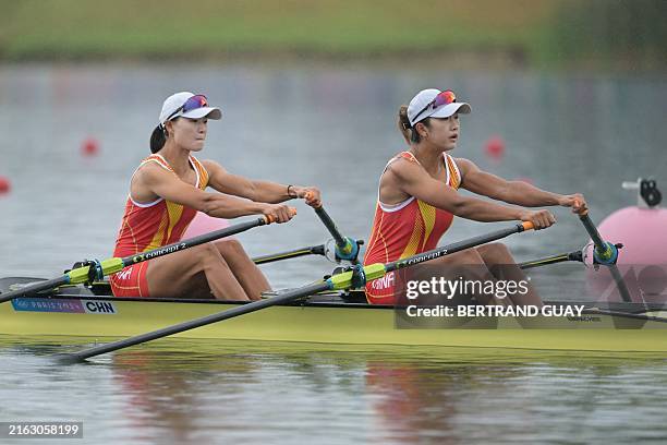 China's Shen Shuangmei and China's Lu Shiyu compete in the women's double sculls heats rowing competition at Vaires-sur-Marne Nautical Centre in...