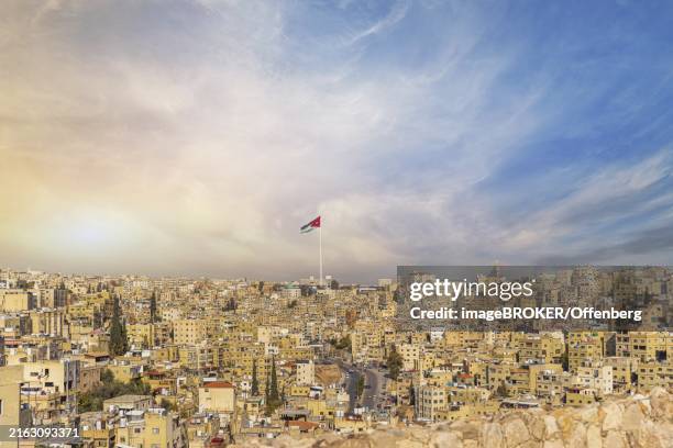 jordan flag in amman, panorama view of cloudy sky - amman stock pictures, royalty-free photos & images
