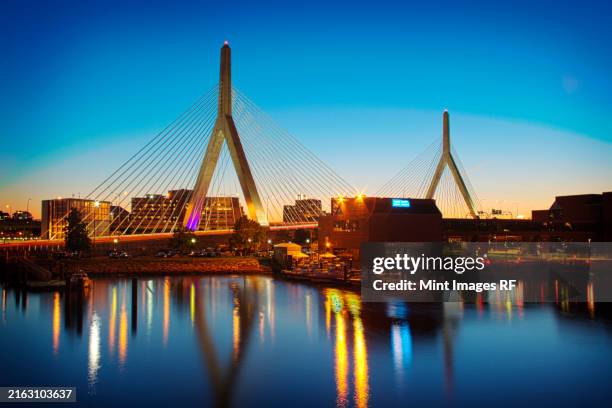 view of the zakim bridge at night, boston, massachusetts - boston stock-fotos und bilder