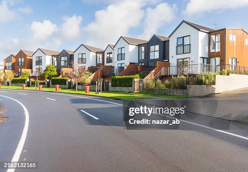 Houses align a residential district next to road. Houses align a residential district next to road.