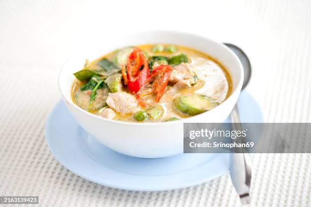 green curry with fish balls a spicy thai food experience with fresh and nutritious ingredients like lemongrass, basil and lime, perfect for a healthy diet. - thai culture stock pictures, royalty-free photos & images