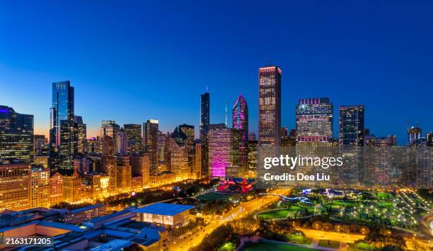 chicago downtown loop aerial at dusk with millennium park - millennium park chicago stock pictures, royalty-free photos & images