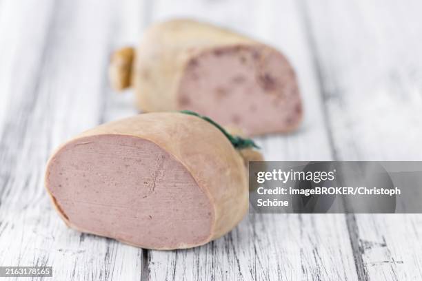 german leberwurst on an old wooden table as detailed close-up shot (selective focus) - leberwurst stock pictures, royalty-free photos & images