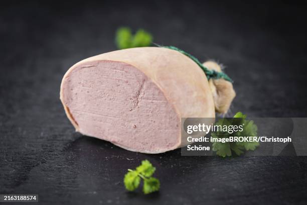 portion of german leberwurst as detailed close up shot on a slate slab (selective focus) - leberwurst stock pictures, royalty-free photos & images