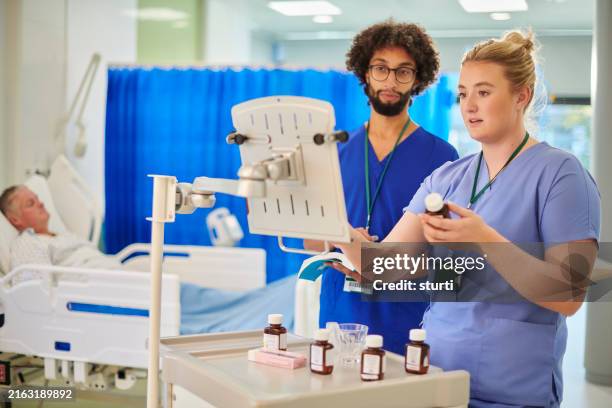 nurse team prescribing ward medicines - hospital gurney stock pictures, royalty-free photos & images