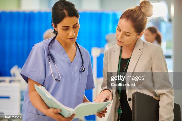 hospital consultant chatting to administrator - medical sales representative stock pictures, royalty-free photos & images