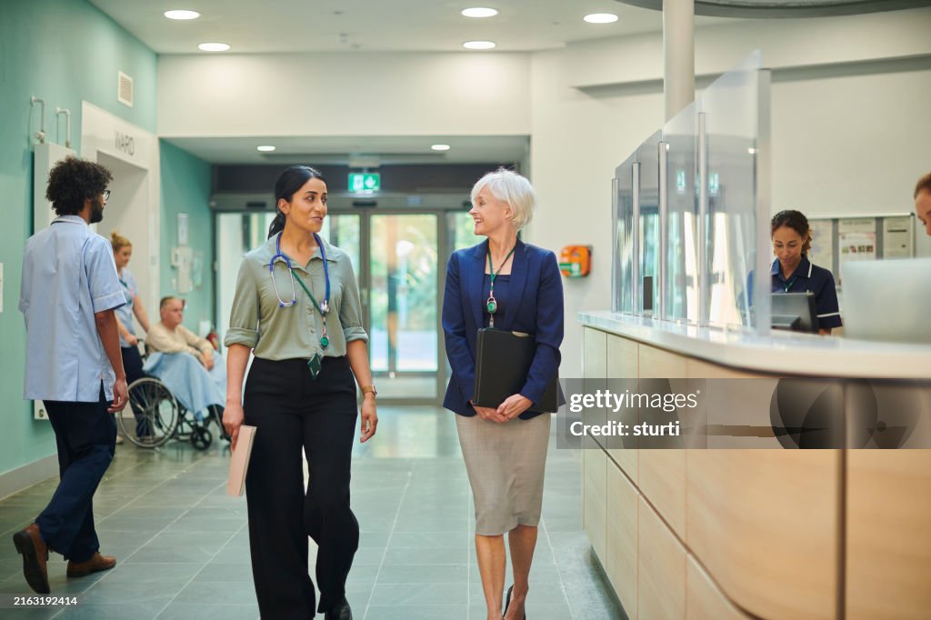 Medical sales representative with female doctor