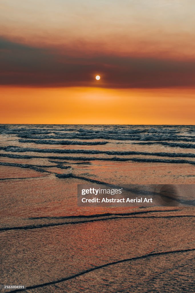 Portrait photograph showing a sunset from Cable Beach, Broome, Western Australia, Australia