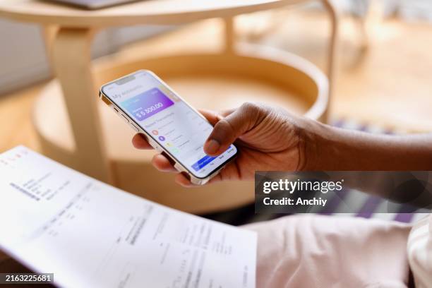 an unrecognizable person paying bills online - banking stock pictures, royalty-free photos & images
