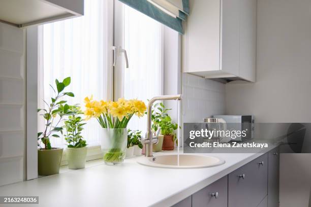 beautiful bright kitchen with a window - fensterrahmen stock-fotos und bilder