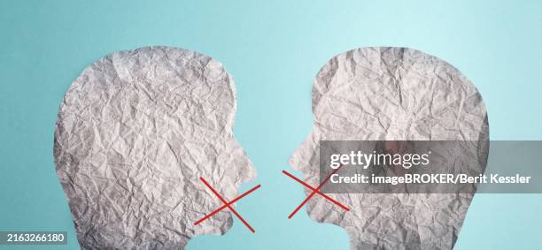 two silhouette faces look at each other, red cross over his mouth, censorship free speech, cancel culture - cancel culture stock pictures, royalty-free photos & images