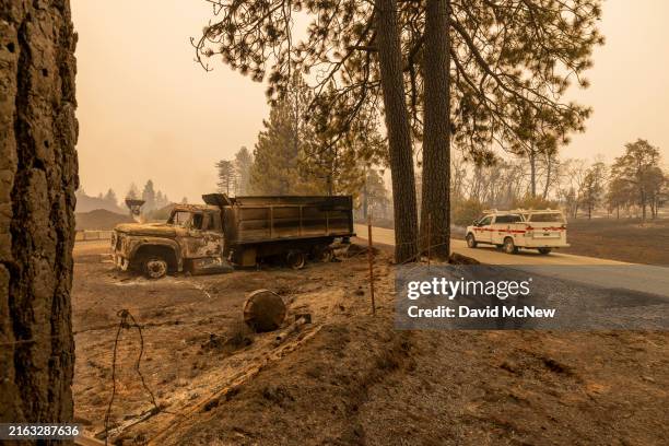 Burned truck is seen near the small community of Payne Creek as the Park Fire, which has grown to 348,370 acres and is still 0 percent contained,...