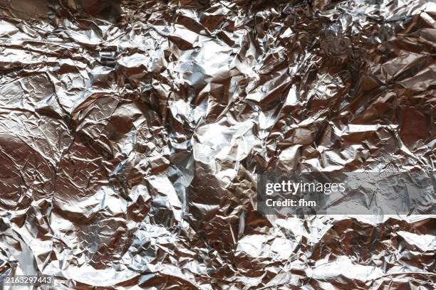 textured crumpled aluminium foil background - full stock pictures, royalty-free photos & images