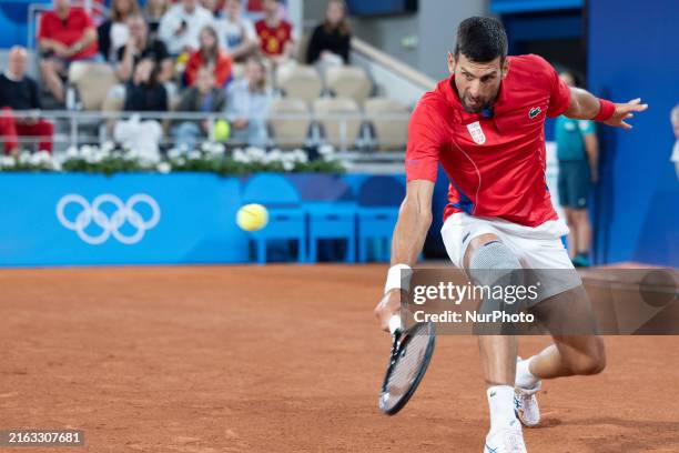 Novak Djokovic is playing during the Men's Singles First Round match against Matthew Eden on day one of the Olympic Games Paris 2024 at Roland Garros...