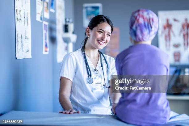children's oncology check-up - oncologist stock pictures, royalty-free photos & images