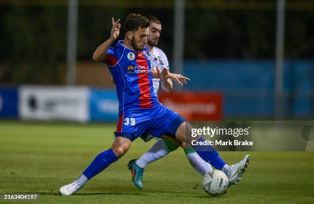 Thomas Aquilina of the Jets competes with Ben Garuccio of Western United during the Australia Cup Play-Off match between Brisbane Roar and Perth...