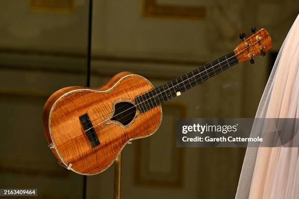 Ukulele played by Taylor Swift on the ‘Speak Now’ world tour on display at the Taylor Swift "Songbook Trail" photocall at The V&A on July 24, 2024 in...