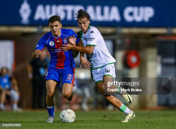 Matthew Scarcella of the Jets competes with Oliver Lavale of Western United during the Australia Cup Play-Off match between Brisbane Roar and Perth...