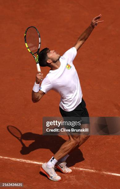 Carlos Alcaraz of Team Spain serves during the Tennis training session ahead of the Paris 2024 Olympic Games at Roland Garros on July 24, 2024 in...
