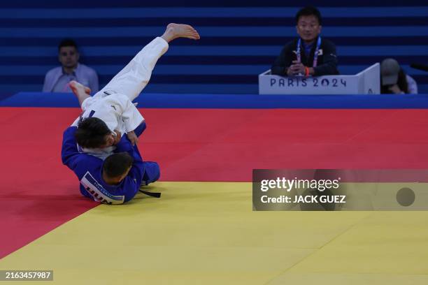 Italys matteo piras and serbias strahinja buncic compete in the judo mens round of Italys matteo piras and serbias strahinja buncic compete in the judo mens round of