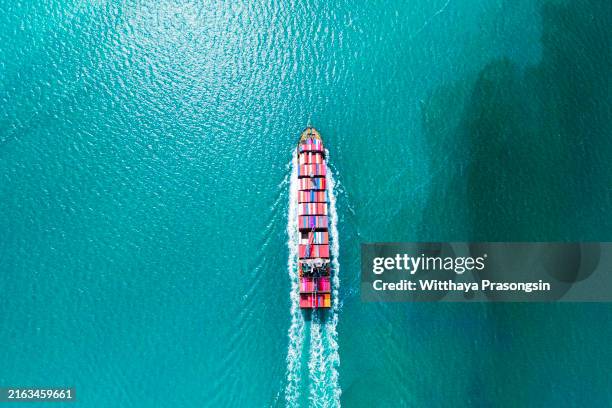 aerial top view container ship in export and import business and logistics. shipping cargo to harbor by crane - shipping container top view - fotografias e filmes do acervo