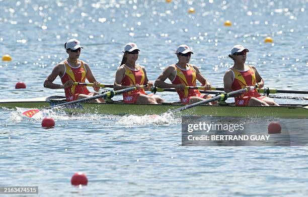 China's Zhang Shuxian, China's Liu Xiaoxin, China's Wang Zifeng and China's Xu Xingye compete in the women's four heats rowing competition at...