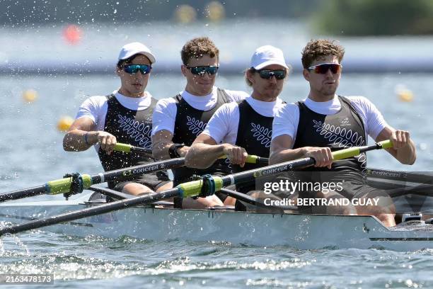 New Zealand's Ollie Maclean, New Zealand's Logan Ullrich, New Zealand's Tom Murray and New Zealand's Matt Macdonald compete in the men's four heats...