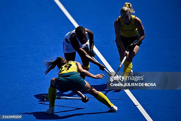 South Africa's midfielder Edith Molikoe is marked by Australia's midfielder Rebecca Greiner in the women's pool B field hockey match between...