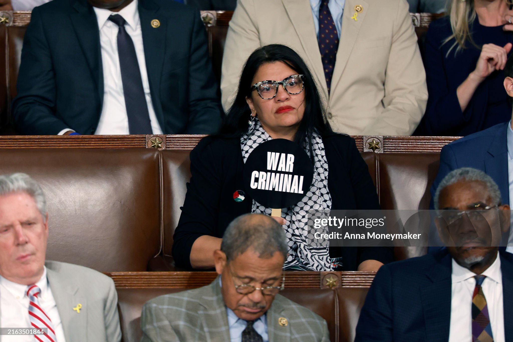 JULY 24: Rep. Rashida Tlaib (D-MI) holds a sign that reads